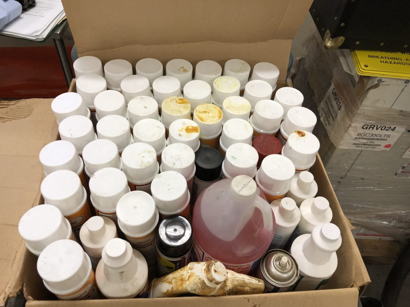 A box filled with a lot of different types of liquids.
