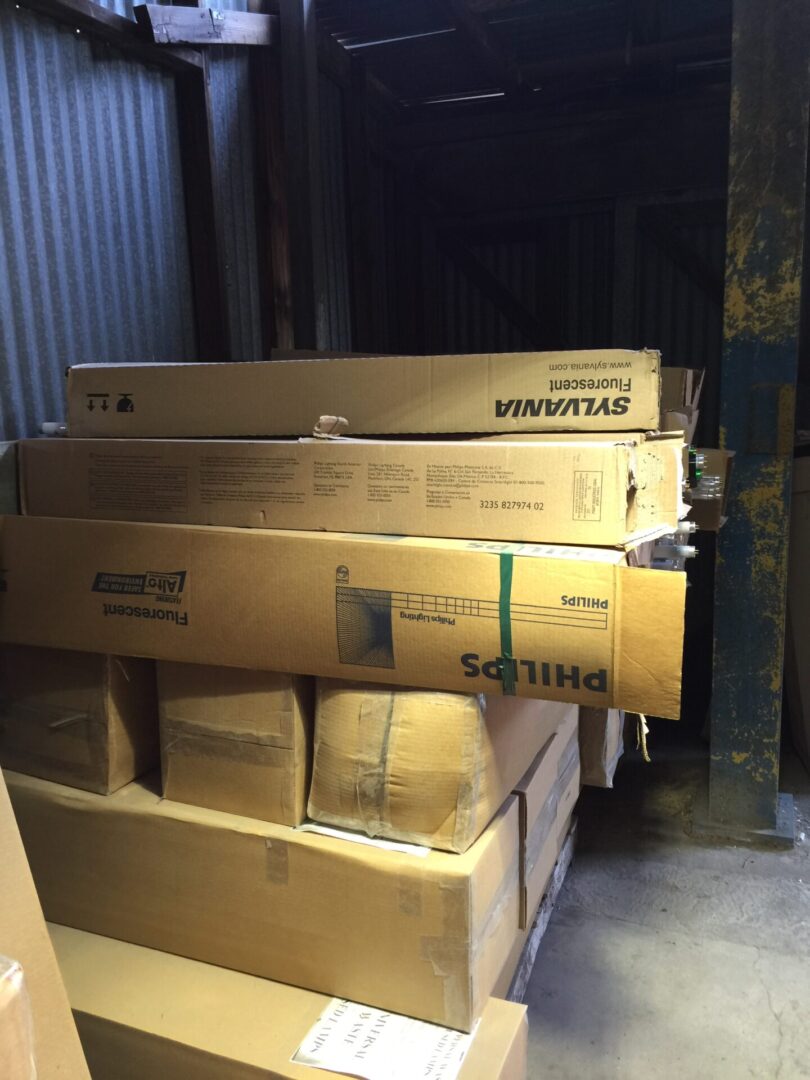A lot of boxes are sitting in a warehouse.